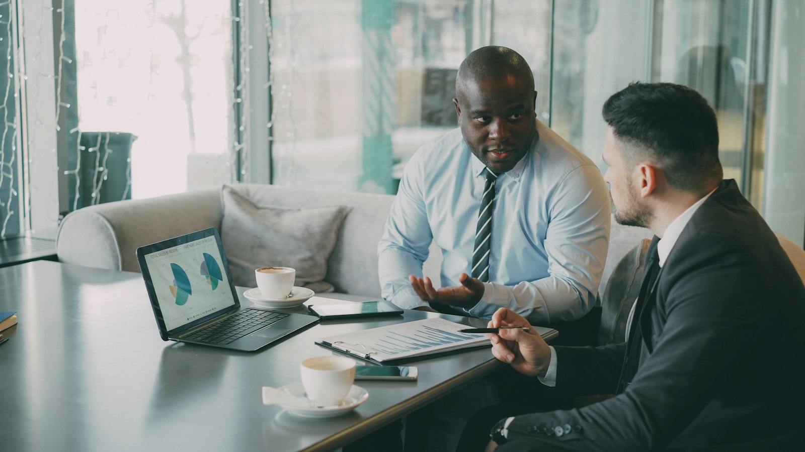 Investment professionals reviewing portfolio charts